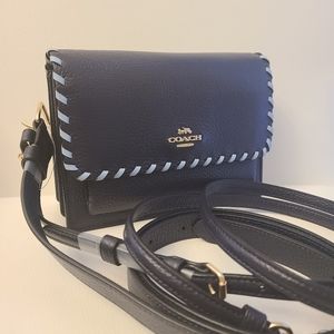 Coach foldover with whipstitch